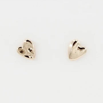 Capture hearts with these charming Hammered Heart Stud Earrings, the perfect Valentine's Day gift. Crafted in lustrous gold with a textured hammered finish, these delicate studs add romantic elegance to any look.
Size: .5"