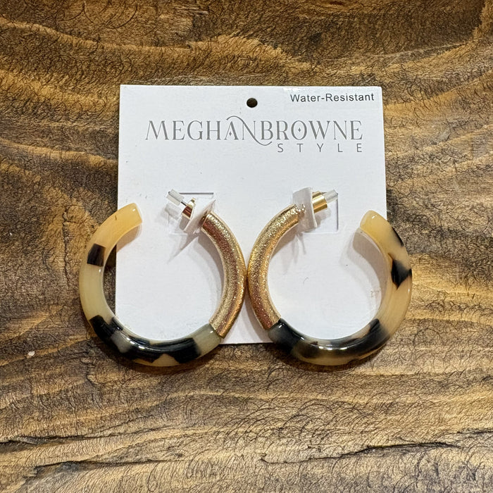 These Tortoise & Gold Hoop Earrings are your go-to accessory for any occasion. Designed with a timeless aesthetic, they work beautifully for evening events, casual outings, and everything in between. The post-back closure provides secure, comfortable wear all day long. With their striking black and gold finish, these hoops add instant polish to your look while remaining a versatile wardrobe essential that pairs with virtually any style. Great for game day too!
