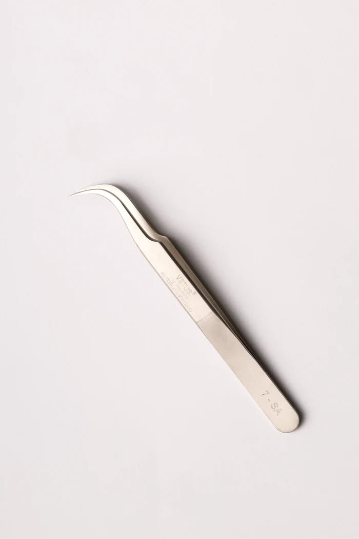 Silver precision tweezers with curved fine tips and sleek metallic finish as a solution for lash techs in malta