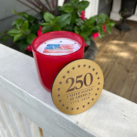 Celebrate America's milestone with these stunning 250th United States Commemorative Candles. Each dual-wick candle features a luxurious gold lid and comes in patriotic red or blue, making it the perfect keepsake for this historic occasion. The beautiful container is designed to be treasured long after the candle burns down, serving as a lasting reminder of this momentous anniversary. Ideal for collectors, patriots, and those who appreciate meaningful home décor.