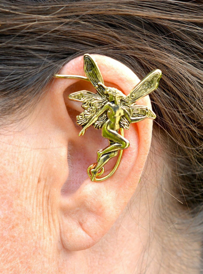 gold fairy elf ear cuff worn on ear non piercing winged ear jewelry close up side view