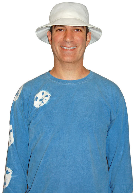 Man wearing a white bucket hat and blue long-sleeve shirt on a white background.
