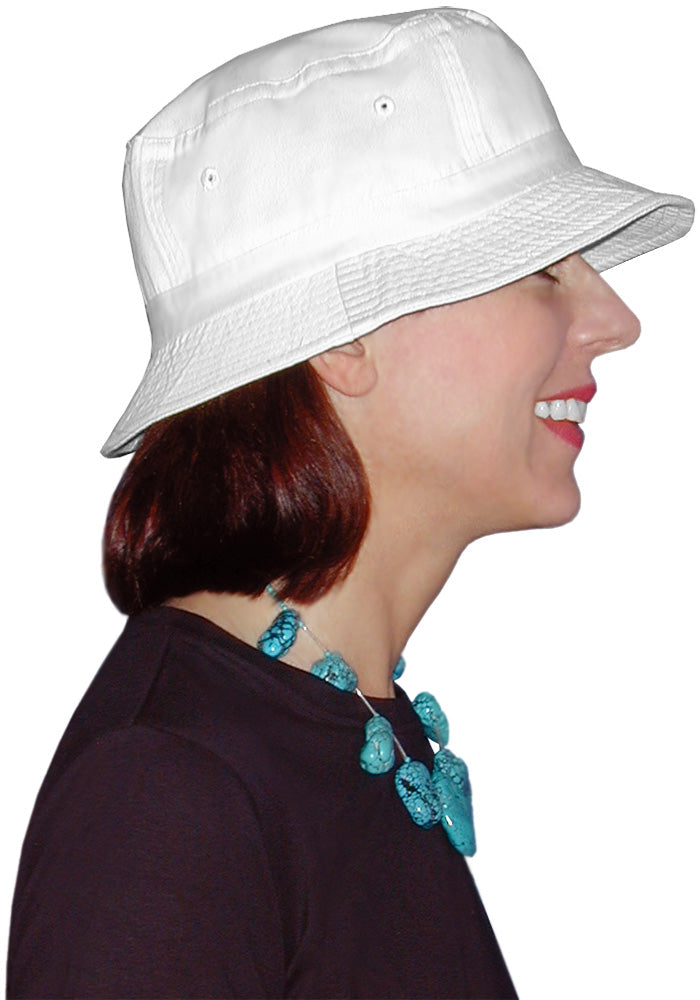 side view  of woman wearing a white bucket hat and turquoise necklace on a white background