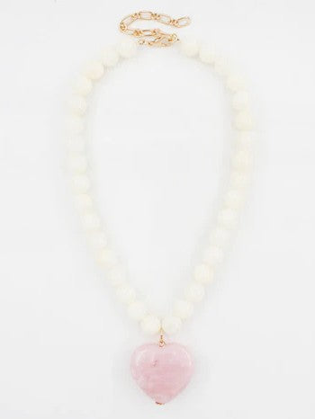 Celebrate love and natural beauty with this charming beaded stone necklace featuring a delicate pink heart pendant. Crafted with smooth white stone beads that complement the warm rose tones of the heart, this versatile piece transitions effortlessly from Valentine's Day romance to spring celebrations and beyond.&nbsp;

Length: 16-18"