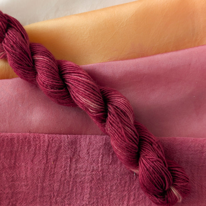 Sappanwood - Caesalpinia sappan Dyed examples were done at 50% OWG. We used our Silk Hankies (#SH), our Cotton Bubble Gauze (#CG2-50"), and our Single Sock HT Mini Skeins (#YARN104)