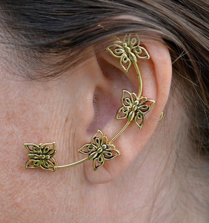 gold butterfly ear cuff worn on ear wrap non piercing earring side view