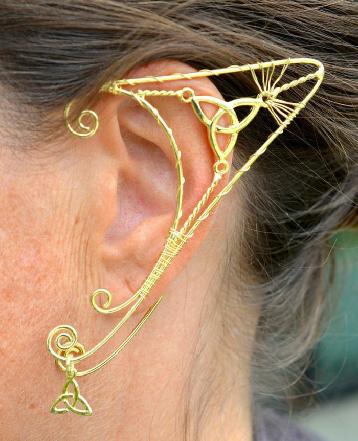 gold elf ear cuff worn on ear trinity knot wire wrap non piercing ear jewelry side view