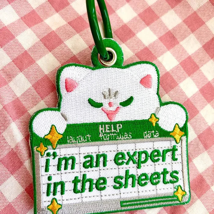 Expert in the Sheets Embroidered Keychain