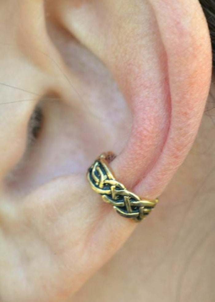 gold celtic knot ear cuff worn on ear non piercing earring side view