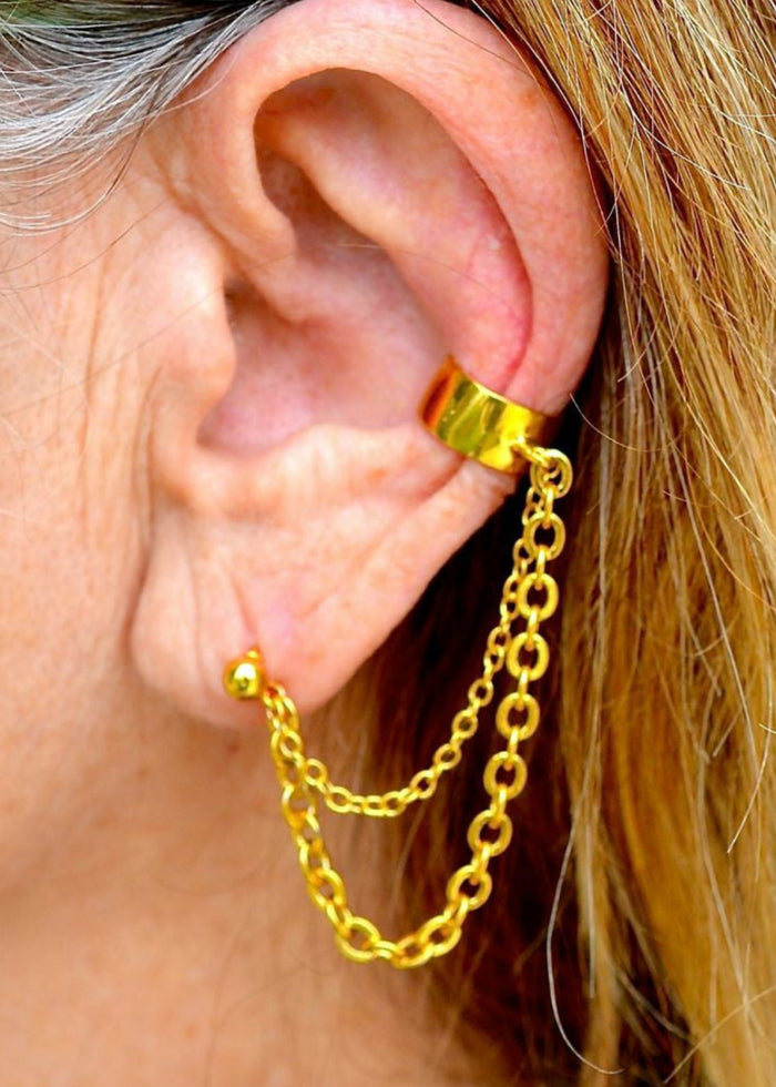 gold ear cuff with chain to stud earring worn on ear non piercing double chain side view