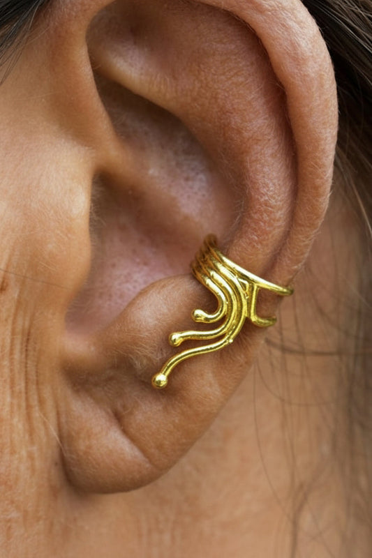 gold spiral wave ear cuff on ear non piercing earring side view