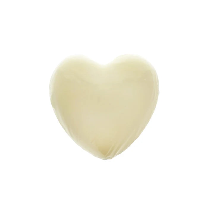 A heart-shaped, solid white soap against a white background