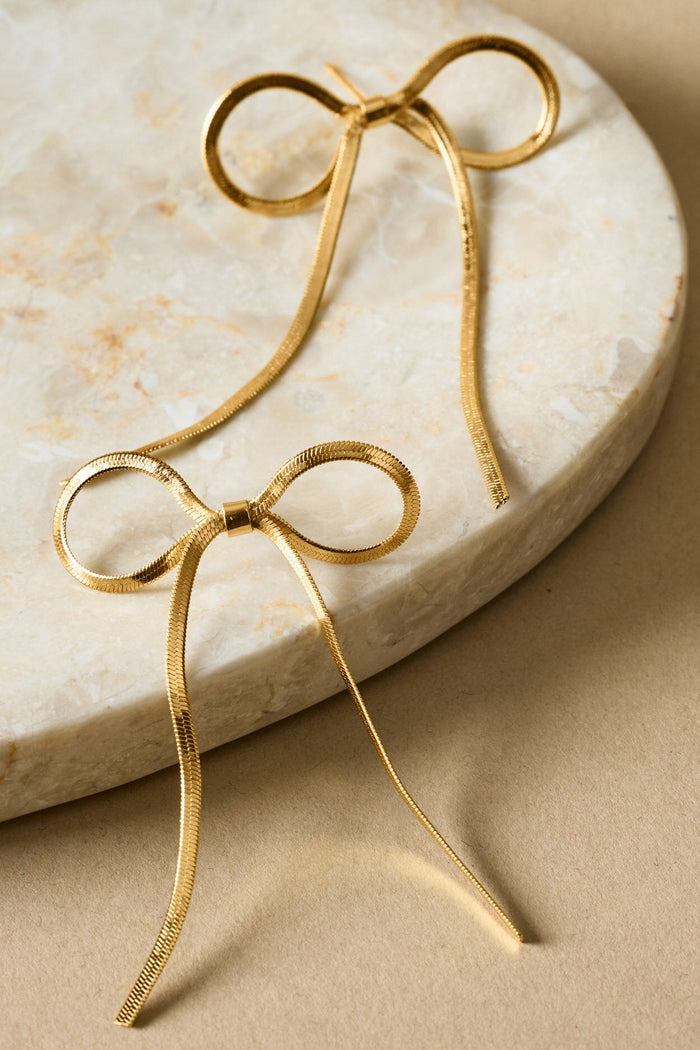Katie Loxton: Amelie Waterproof Gold Bow Oversized Earrings - B Social Boutique