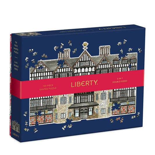 Jigsaw puzzle box with Liberty branding and architectural design on a blue background