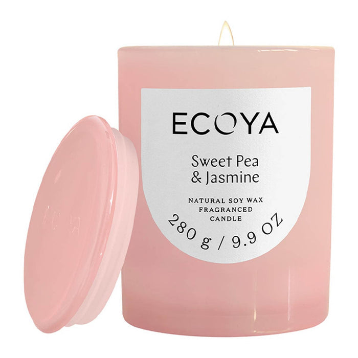 Ecoya Metro Jar Candle - Sweet Pea & Jasmine. Pink jar with white label. Includes a glass lid.