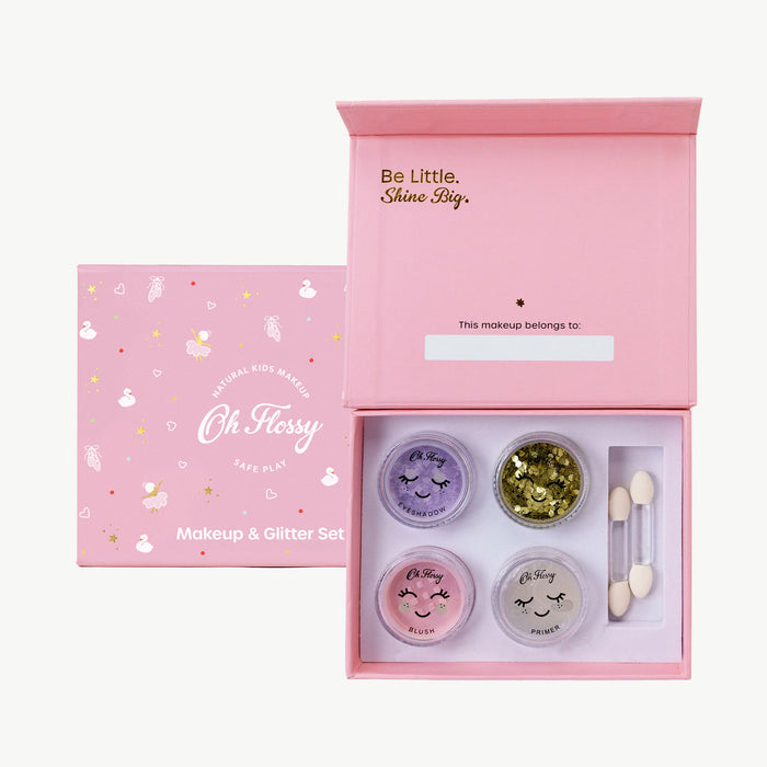 Makeup and glitter set with 'Oh Flossy' branding in a pink box.