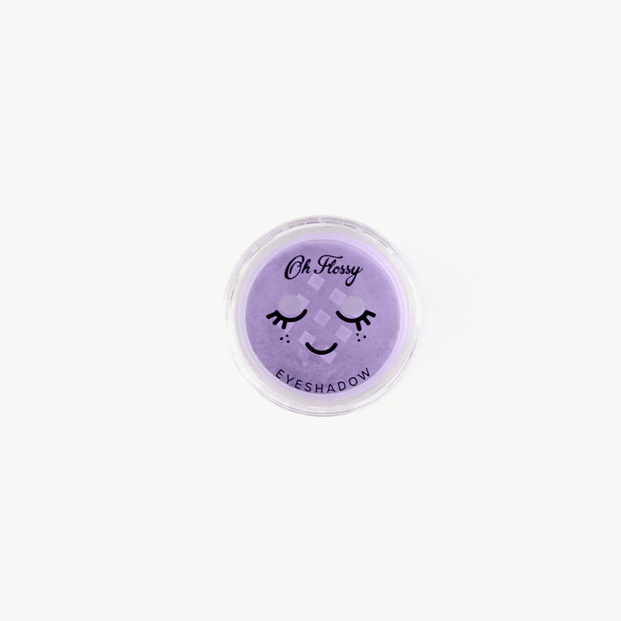 Lilac eyeshadow compact with a smiley face design on a white background