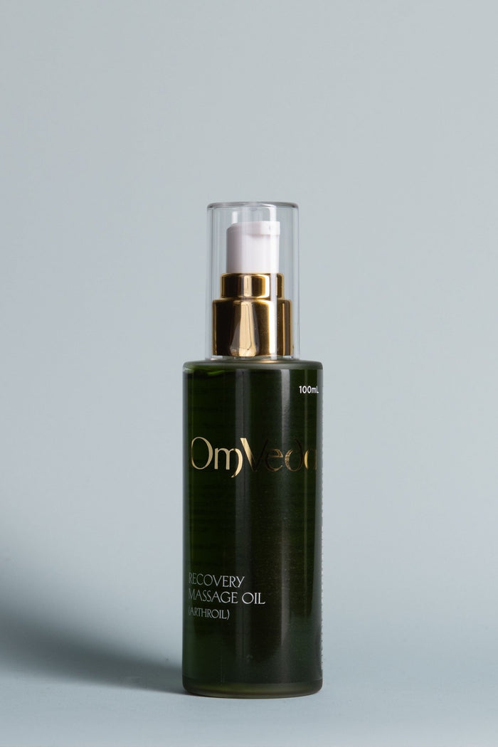 Recovery body oil bottle with gold pump, dark green glass, clear top, 100ml