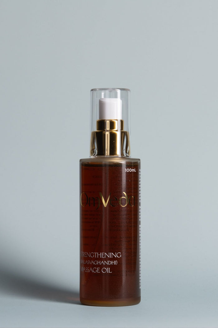 Strengthening body oil bottle, amber liquid, gold pump top, 100 ml