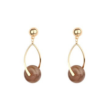 Transform your everyday style with these elegant open drop posts, where warm gold tones frame a mesmerizing stone accent that adds dimension and allure. The spacious, open design creates visual lightness while the natural stone brings organic sophistication to your look.&nbsp;