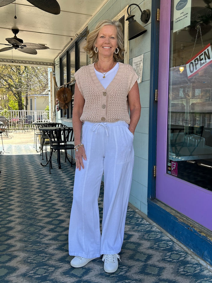 Effortlessly elegant and endlessly wearable, the Solana White Linen Pants bring relaxed sophistication to any wardrobe. Crafted from breathable linen, these pants feature a comfortable elastic waistband with adjustable drawstrings for a customized fit. The flowing wide-leg silhouette flatters every frame, while dual side pockets add practical style. Perfect for warm-weather dressing, from casual weekends to elevated summer occasions.

Material: 55% Linen / 45% Rayon

Care Instructions: Machine Wash Cold