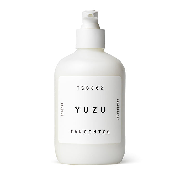 A white bottle with a pump dispenser labeled 'Yuzu Tangent GC