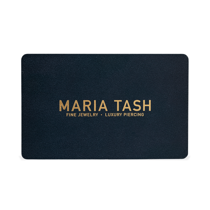 MARIA TASH close-up ear styling featuring delicate diamond studs and curated piercing combinations