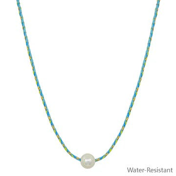 This wrapped thread necklace combines artisanal design with understated sophistication. Multiple chain color options intertwine to create a dynamic, textured look that complements any wardrobe. The luminous freshwater pearl centerpiece adds a classic touch of elegance without overwhelming your style.&nbsp;

Length: 16-18"