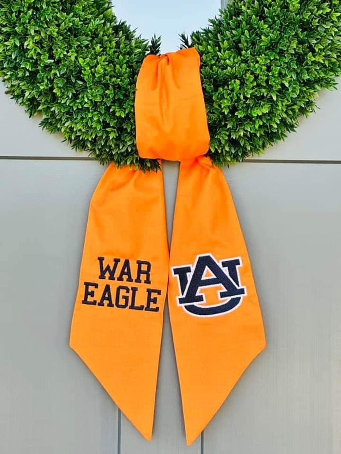 Decorate your front door or embellish your interiors with a seasonal Wreath Sash. Sashes can be personalized in any number of ways... with a monogram, last initial, seasonal design,... you name it.&nbsp;  These are great for game day, 4th of July, baby showers - your name it!  These 100% cotton sashes are our most affordable sash options. Order yours with one or two monograms and then we will reach out to plan your custom sash.  Dimensions: 50" x 5"